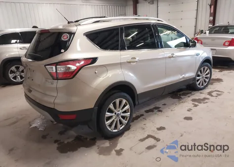 2017 Ford Escape Titanium z USA, uszkodzony, nr VIN 1FMCU9J98HUD02977